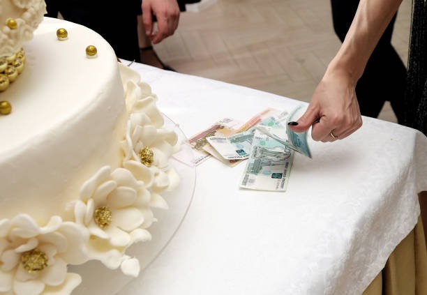 Unique Celebration Ideas Start with a Money Pulling Cake
